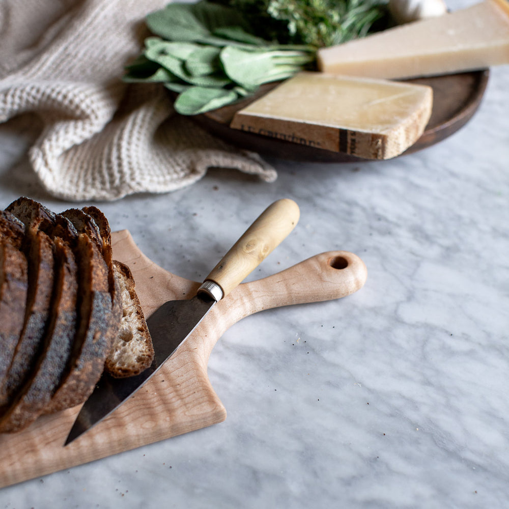 HAND CARVED CURLY MAPLE CUTTING BOARD