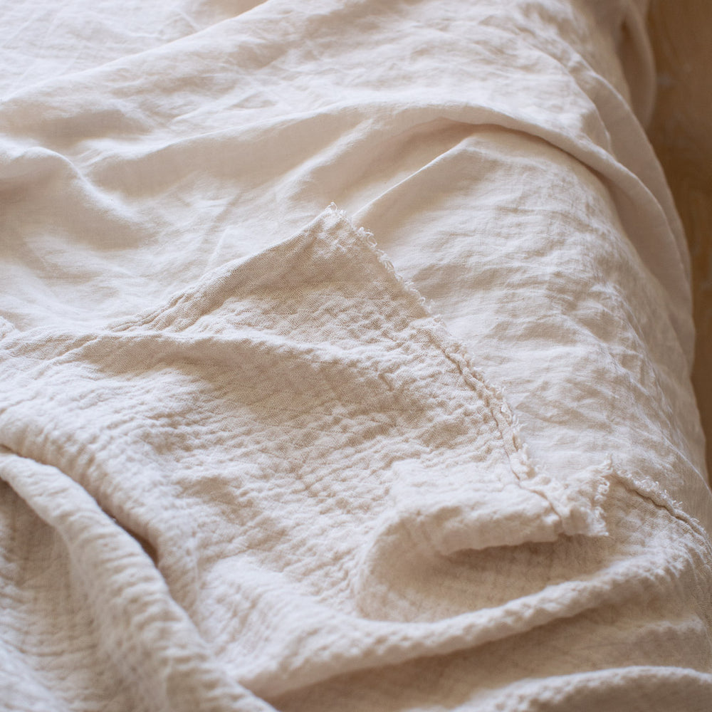 HANDMADE CRUSHED LINEN BLANKET IN WARM WHITE