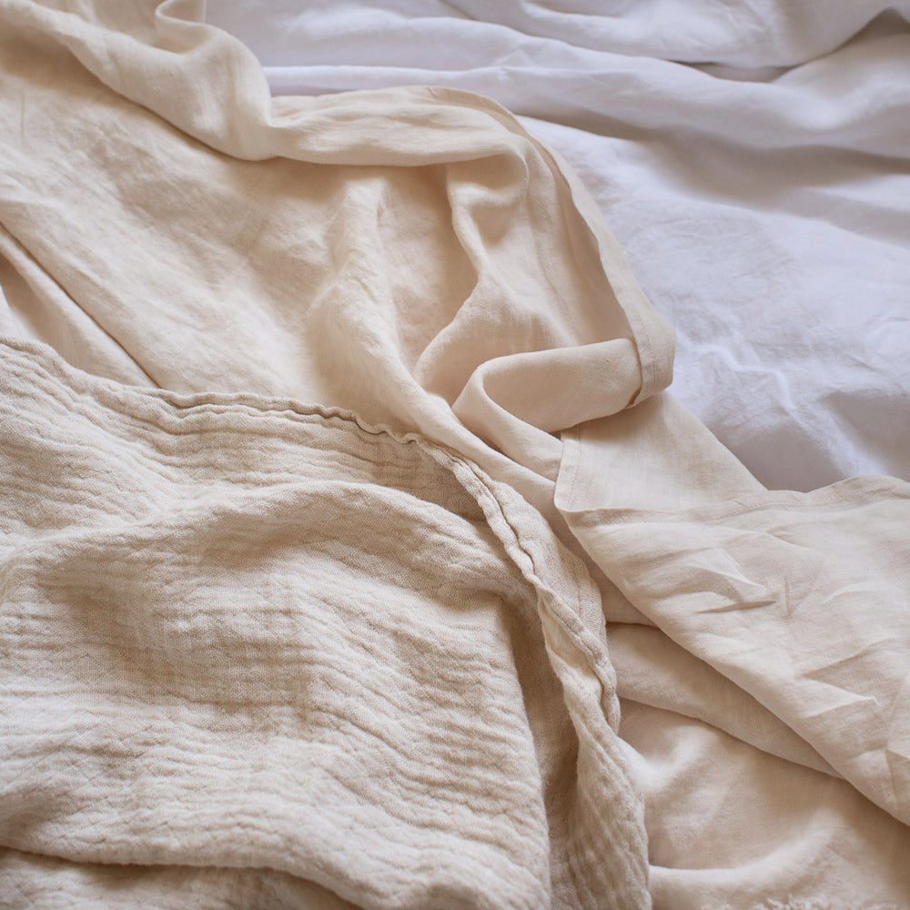 HANDMADE CRUSHED LINEN BLANKET IN WARM WHITE