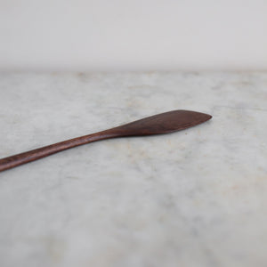 Hand carved brown wooden cooking spatula 