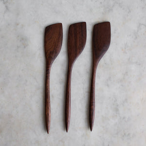 Handmade dark wooden cooking spatulas 