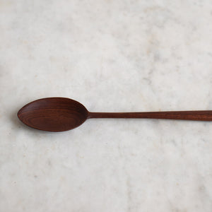 delicate hand carved wooden cooking spoon 