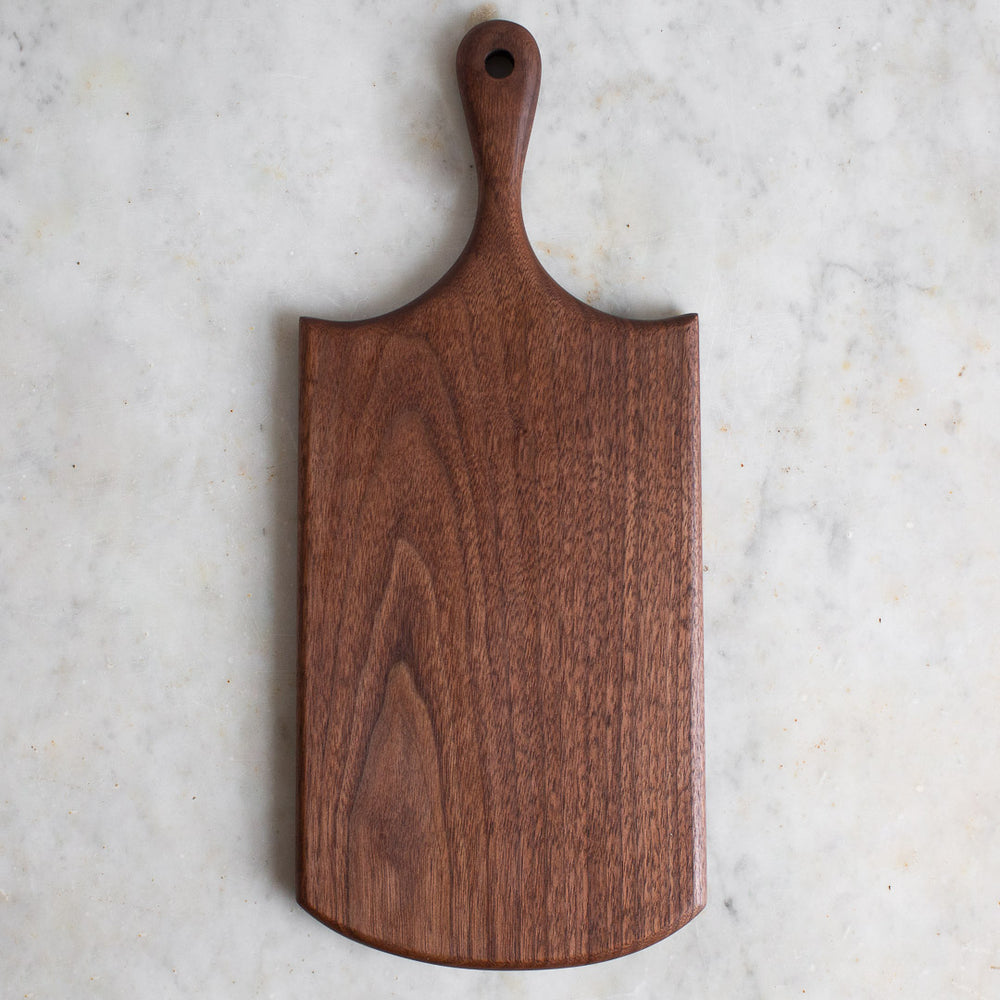 HAND CARVED BLACK WALNUT CUTTING BOARD