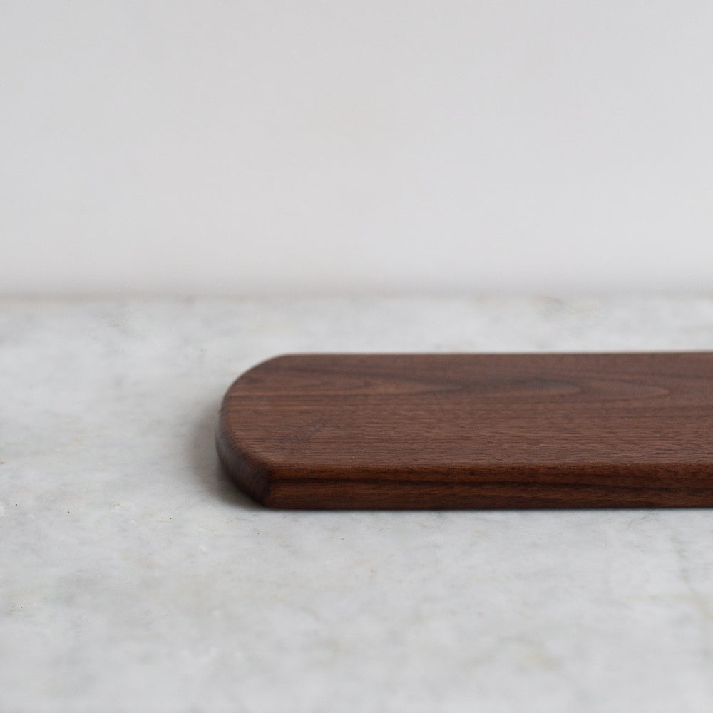 HAND CARVED BLACK WALNUT CUTTING BOARD