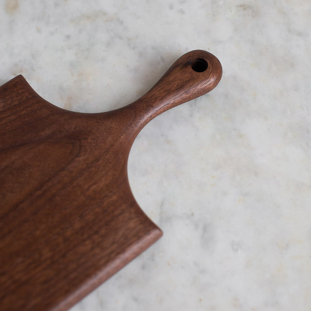 HAND CARVED BLACK WALNUT CUTTING BOARD