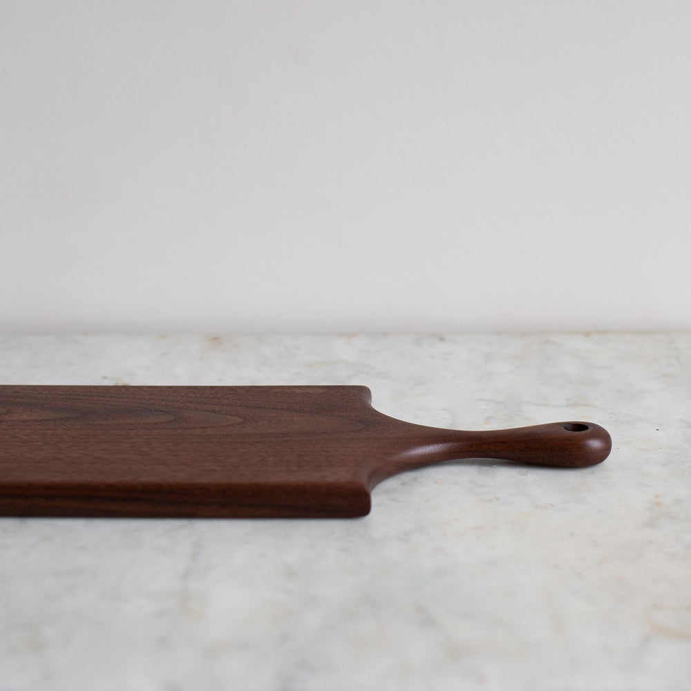 HAND CARVED BLACK WALNUT CUTTING BOARD