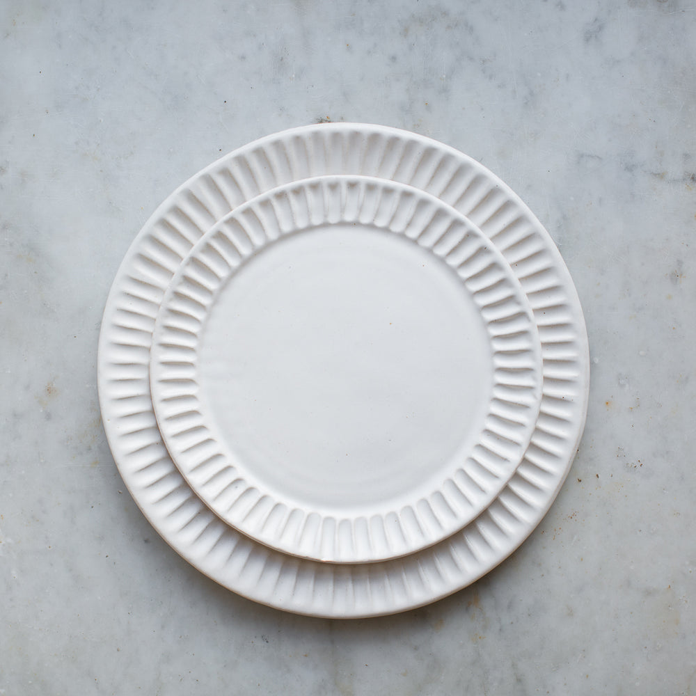handmade stoneware fluted dinner plate in matte white glaze