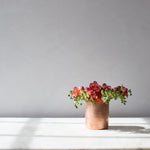 copper cup flowers bright sunny marble table 